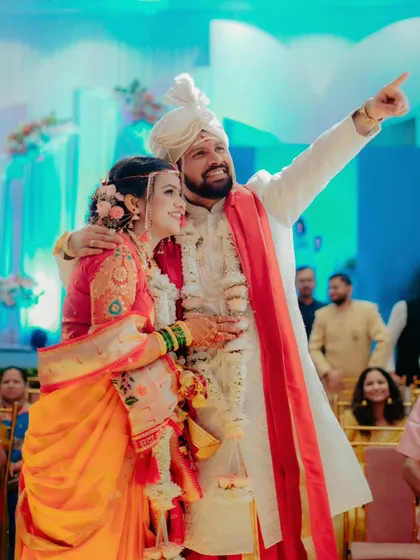 A moment of shared joy and excitement as the couple looks towards their future together during the reception.