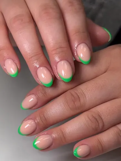 A fun and vibrant French manicure with neon green tips. This is a great way to incorporate bright colors into your look while keeping it chic.