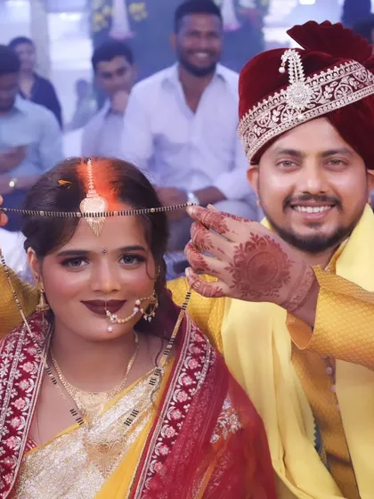 The mangalsutra ceremony, symbolizing the sacred union. The bride's glowing makeup and happy expression make this moment even more special.