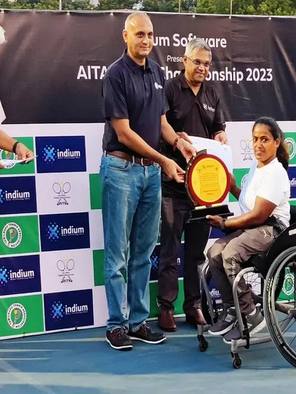 A close-up of our player receiving her singles winner plaque at the AITA Championship. Each award represents countless hours of dedication and hard work.