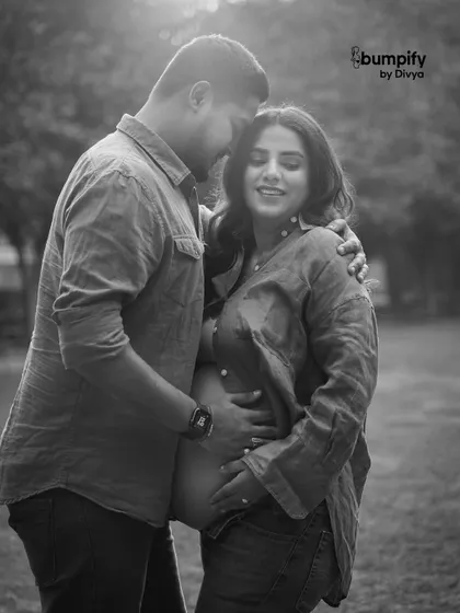 Sometimes a simple, black and white photograph captures the most emotion. This intimate outdoor portrait focuses on the quiet connection and the beautiful baby bump, creating a timeless piece of art.