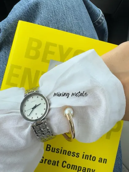 A small detail from my day: mixing metals. A silver watch with a gold and pearl bracelet is a chic way to show that style rules are meant to be broken. Accessories are all about personal expression.