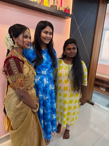 A proud moment with one of my students and her beautifully made-up model during a portfolio review.