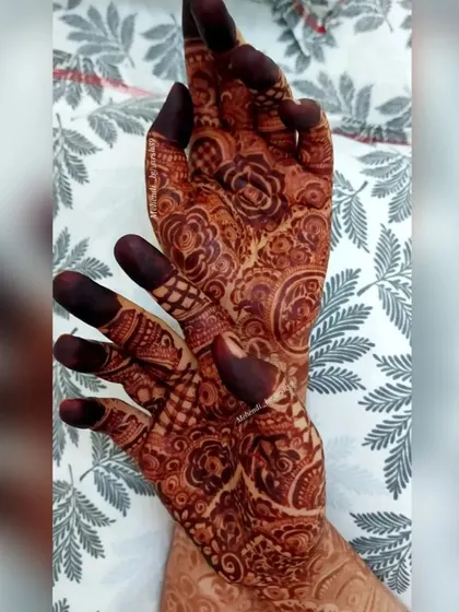 A creative angle showing the detailed palm work of a bridal design.