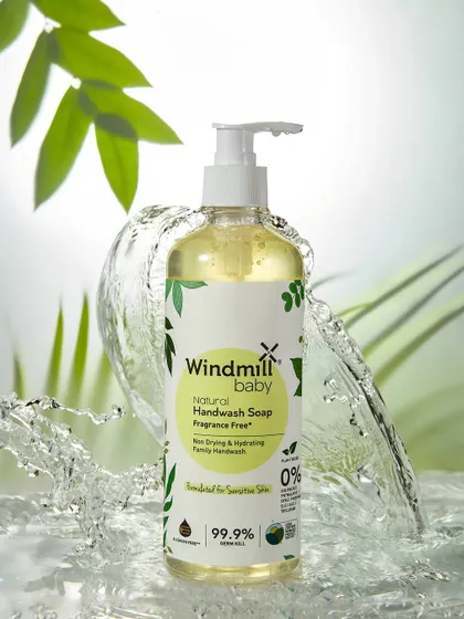 Another angle from the Windmill Baby shoot, this image provides a slightly different view of the water splash. Showing multiple shots from the same series demonstrates consistency and creative exploration.