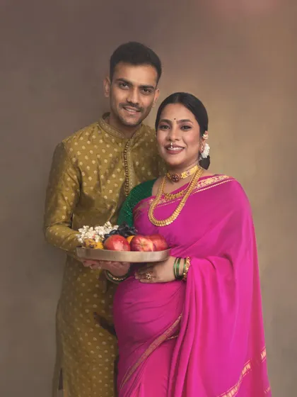A traditional pose where the couple holds a platter of fruits, symbolizing prosperity and blessings for the baby. It’s a culturally significant moment captured in my signature painterly style.