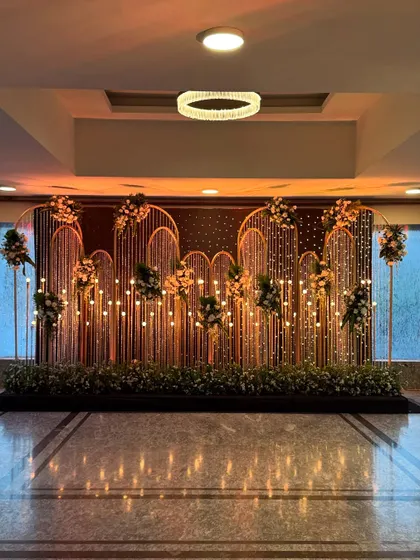 The photo booth backdrop under warmer lighting, creating a cozy and inviting glow for evening pictures.