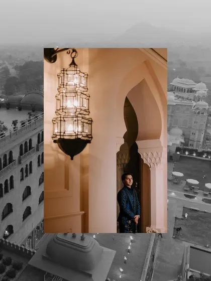 A portrait of the groom against the stunning backdrop of the Fairmont Jaipur at dusk. The architecture adds a sense of grandeur to the Sangeet photos.