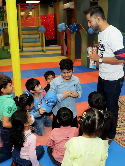 An entertainer engages the children with a fun, interactive game. I ensure there's always a structured activity to keep the party flowing and the kids captivated.