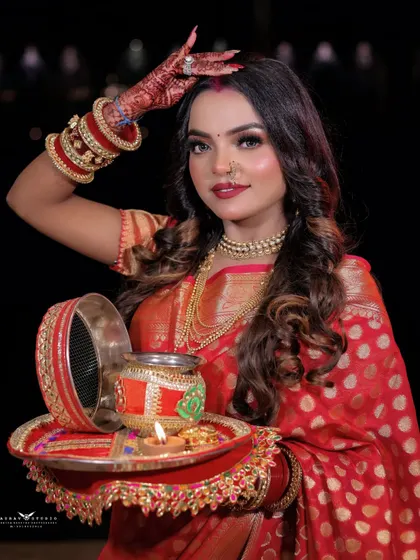 A graceful pose with the model holding her puja thali. Her expression is full of devotion and happiness, perfectly capturing the essence of the festival.