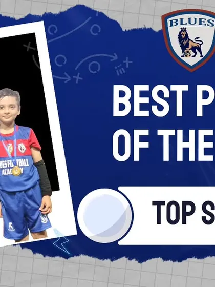 A coach stands with our Player of the Week, recognizing his excellent performance and contribution as a top scorer.