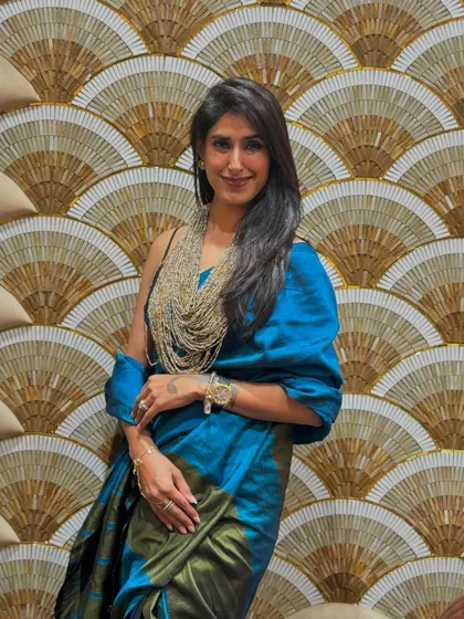A saree is a canvas for self-expression. I love helping clients experiment with different drapes, fabrics, and blouses to create a look that feels authentic to them, whether it's for a big event or a casual day out.
