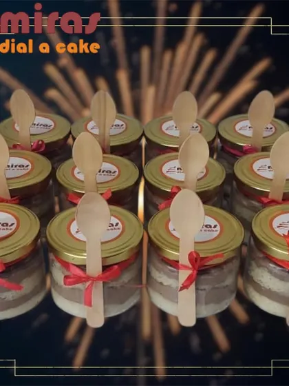 My cake jars are a popular gifting option, perfect for party favors or corporate giveaways. This photo shows a batch of my layered cakes, each sealed in a glass jar with a wooden spoon attached, ready for easy enjoyment.