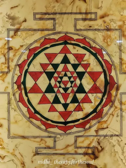 A closer look at the Sri Chakra's interlocking triangles and lotus petals. The geometric precision is crucial for this sacred yantra, and I paint every line with focus.
