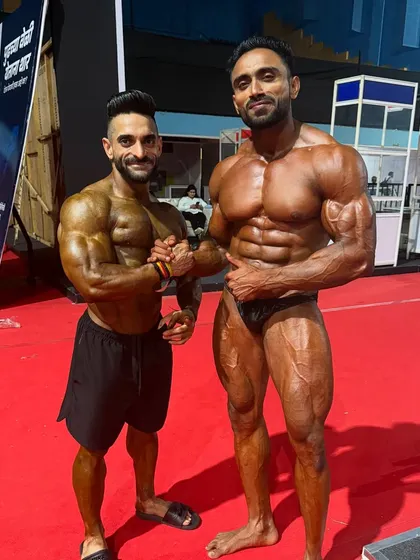 Two champions, one stage. Posing alongside another great athlete, pushing each other to be better.