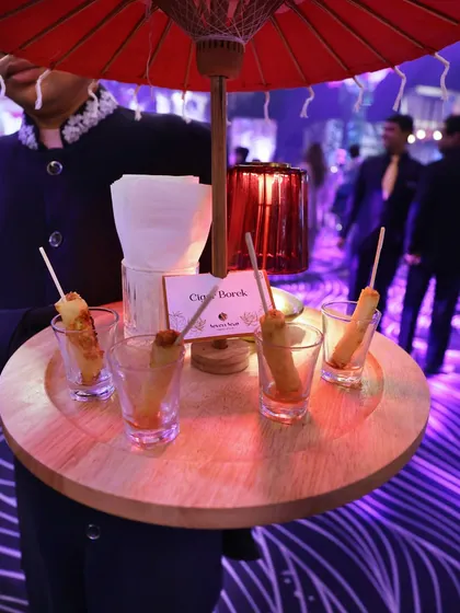 Our Cigar Boreks, served in individual shot glasses. This creative presentation is not only visually striking but also makes for easy and elegant enjoyment during a standing reception.