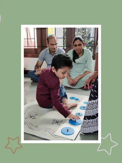 Two young boys confidently present their work to a set of proud parents. These 'Show and Tell' sessions build public speaking skills and allow children to take ownership of their learning.