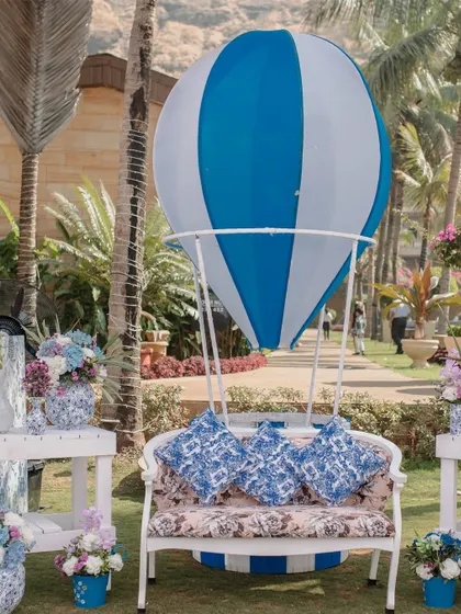 A hot air balloon-themed photo booth, perfect for the blue and white aesthetic of this carnival brunch.