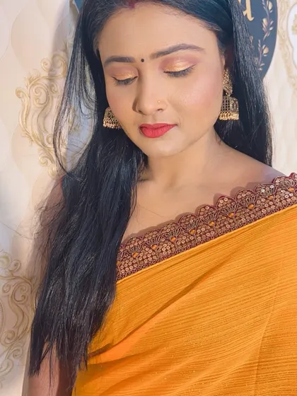 A simple yet elegant look for a daytime event, featuring shimmery gold eyeshadow and a bright red lip. My students learn to create makeup that is appropriate for any time of day.