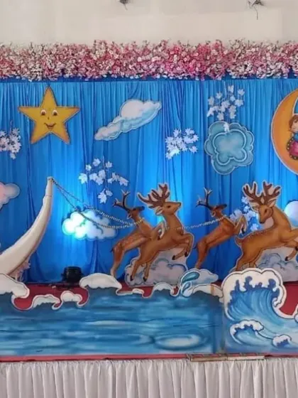 For a unique baby shower, I designed this whimsical night-sky theme. It features a crescent moon boat, stars, clouds, and even reindeer props for a magical feel.