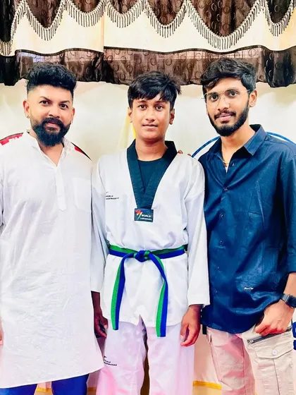 A student with his new green and blue belt.