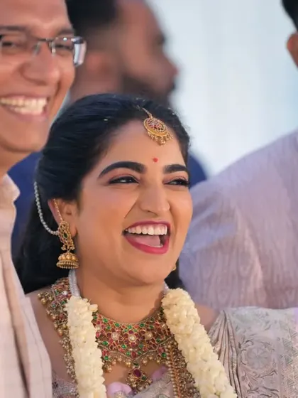 The bride's infectious laughter captured in a candid moment. Our goal is to make you feel comfortable, so your true personality shines through in the photos.