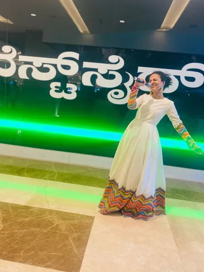Capturing the energy of the event, Nisarga looks radiant in our designer rental wear.