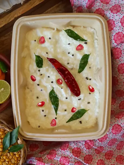 My Curd Rice is the perfect dish to cool down with. It's simple, soothing, and tempered with mustard seeds, curry leaves, and red chili, then garnished with pomegranate seeds.