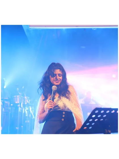 A quiet, focused moment during a performance. Even in the most energetic shows, there are moments of pure musical connection.