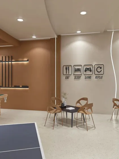 This club features a modern and minimalist design with flowing curves. We used a neutral color palette, terrazzo flooring, and unique lighting to create a chic and dynamic environment for recreation and socializing, including a dedicated game zone.