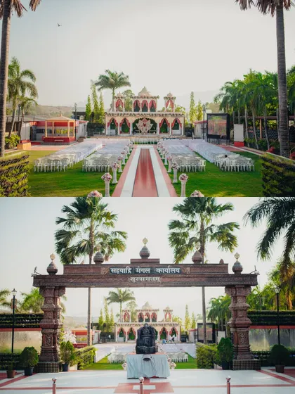 A wide shot of the beautiful outdoor wedding venue, showcasing the grand entrance and decor.
