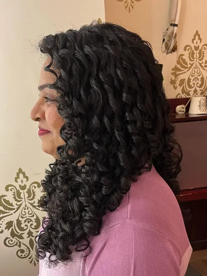 A side view showing the health and definition of her long curls.