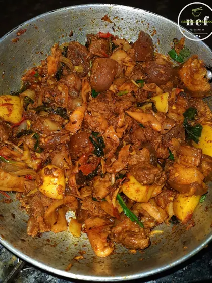 A pan full of my spicy pork with bamboo shoots stir-fry, a dry and intensely flavorful dish.