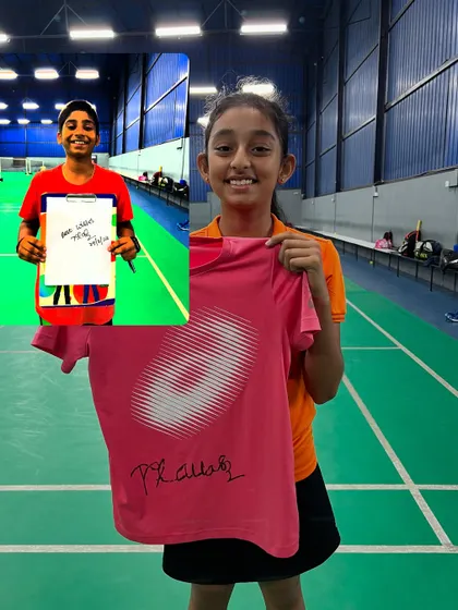 The thrill of meeting your idol. Two young players proudly display their autographs from Prakash Padukone, a cherished memento from their training journey.