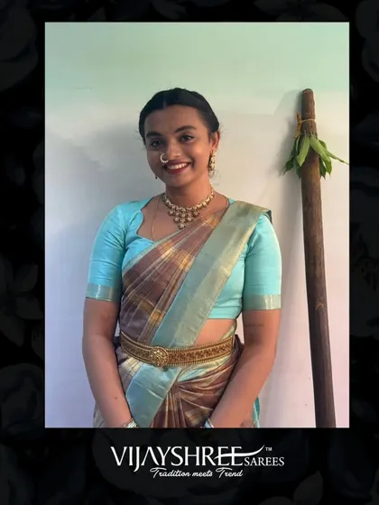 A lovely portrait of Reethu, showcasing her traditional look complete with a waist belt and classic jewelry.