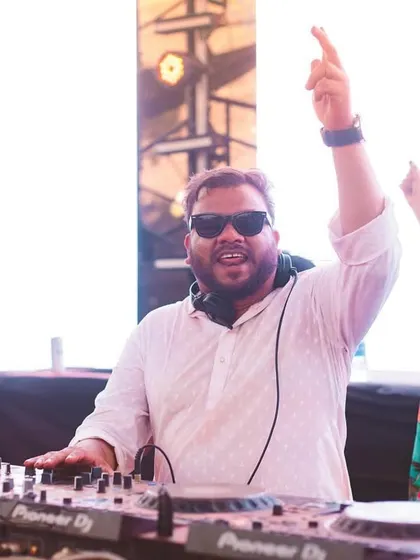 Another shot of me at the decks, getting ready to drop another banger for the Holi crowd.