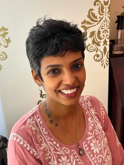 Anusha's smile shows how a great short cut can boost your confidence.