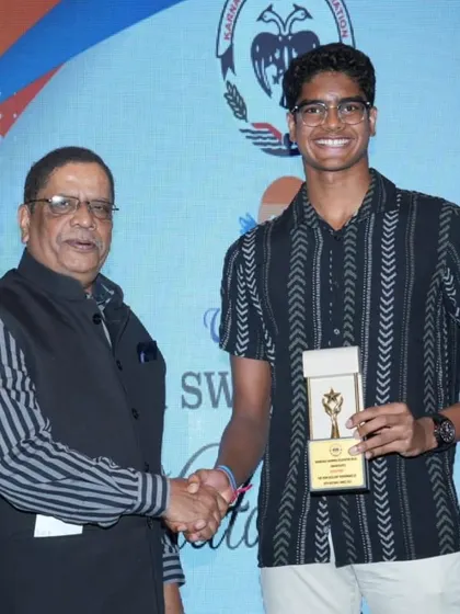 Akash Mani being felicitated for his achievements.