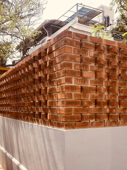 "Don't be another brick in the wall." A look at a recently completed boundary wall, where we used a dynamic, protruding brick pattern to create texture, rhythm, and a play of shadows.