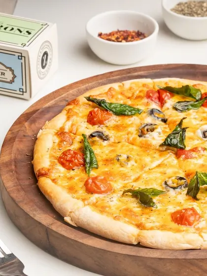 A classic Margherita pizza, perfectly baked with a crispy crust and beautifully melted cheese.