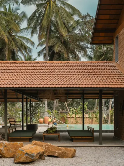 The roof of Villa Maati is covered in classic Mangalore tiles, a traditional material we use for its durability and timeless appeal. It pairs beautifully with the exposed brick walls and surrounding palm trees.