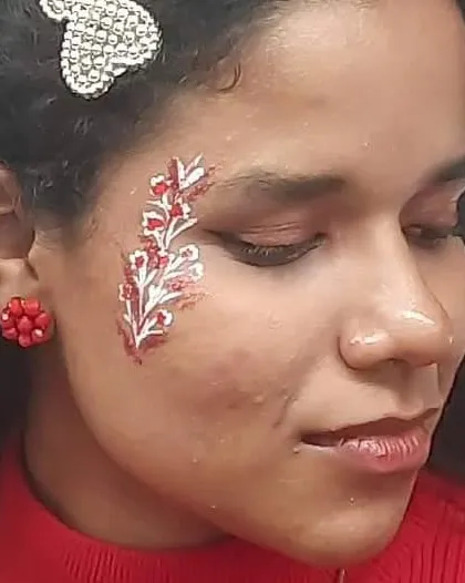 A bold red and white floral design that covers the side of the face, creating a dramatic and artistic statement.