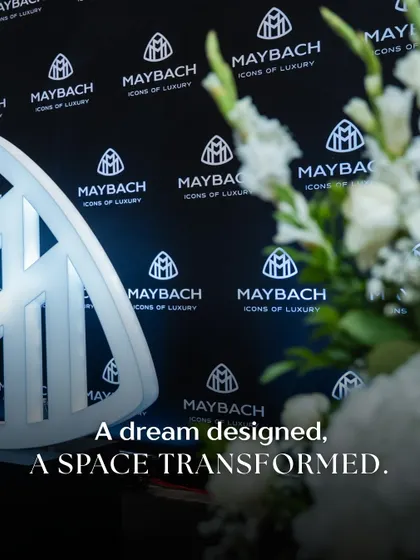 A dream designed, a space transformed. This shot captures the iconic Maybach logo against the custom-designed backdrop, with our floral work softening the edges. It shows how we blend brand elements seamlessly with our decor to create a cohesive visual story.