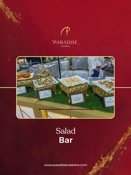 A beautifully arranged salad bar with a variety of fresh options. We use elegant stands and platters to make even the simplest dishes look grand.