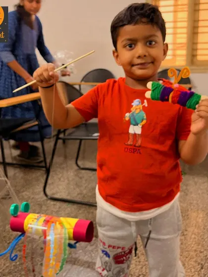 Another proud summer camper with his finished yarn craft and upcycled creature. We love seeing the kids so happy with their work.