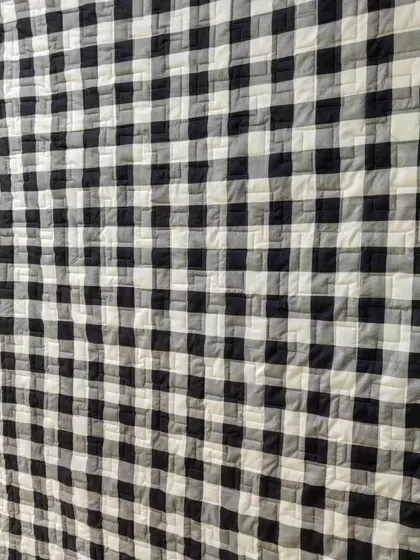 The classic black and white gingham backing for a T-shirt memory quilt.