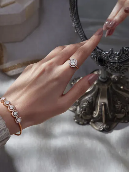 This lifestyle shot for Orra captures a moment of self-reflection. The model's hand, adorned with a ring and bracelet, reaches towards a vintage mirror, creating a narrative that is both elegant and personal.