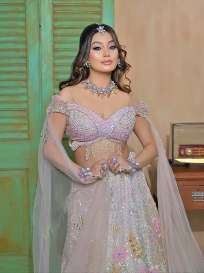 A modern and whimsical look featuring a unique lilac floral jewellery set. This is perfect for a bride who wants a non-traditional color for her pre-wedding events.