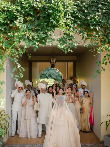 A wider view of the family's emotional reaction to seeing the bride in her wedding attire for the first time.