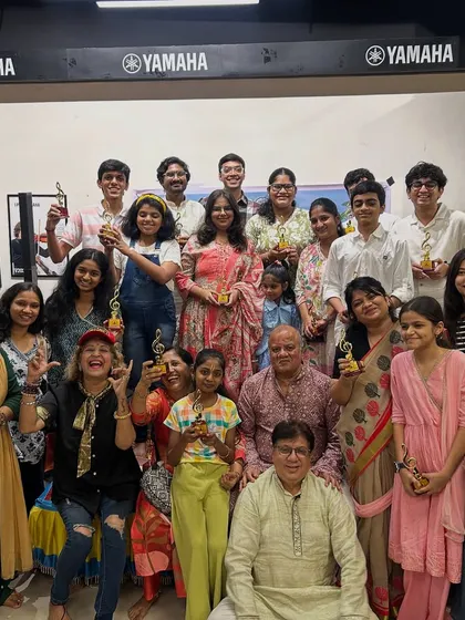 This is our tribe. A snapshot from our Guru Purnima Utsav, celebrating the achievements of our students, young and old, with trophies and loud applause. We are a community of performers, learners, and music lovers.
